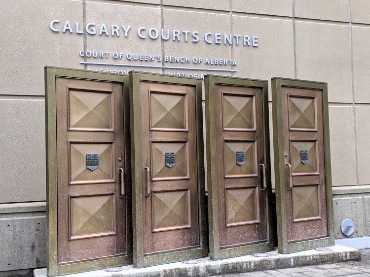 Calgary police officer to stand trial in shooting deaths of two men